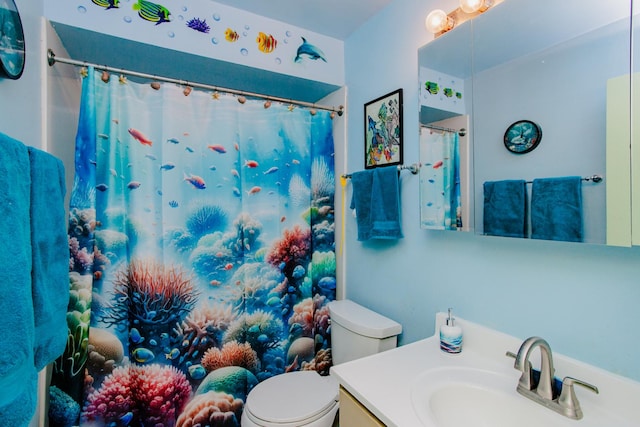 bathroom featuring vanity and toilet