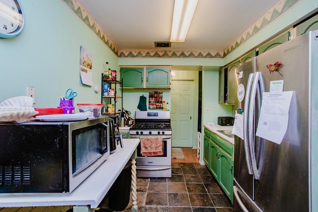 kitchen featuring green cabinetry and stainless steel appliances