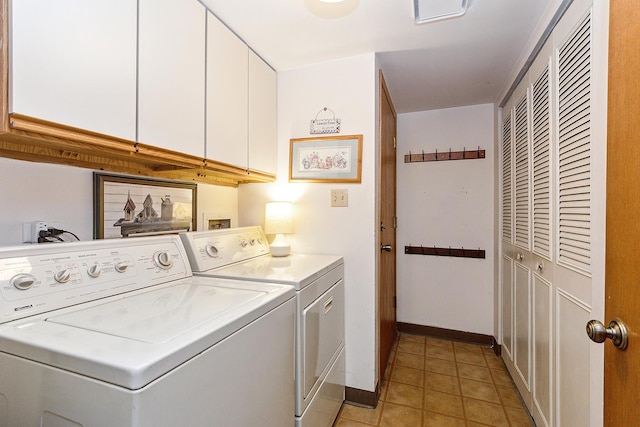 washroom with independent washer and dryer and cabinets