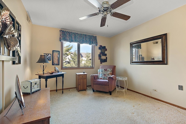 sitting room featuring carpet flooring and ceiling fan
