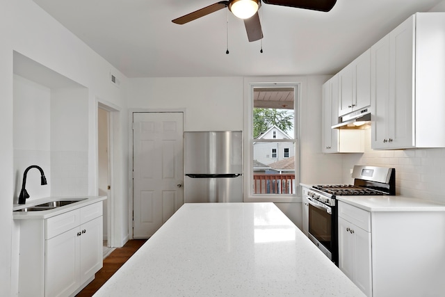 kitchen featuring white cabinetry, sink, tasteful backsplash, and appliances with stainless steel finishes