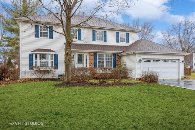 view of front of house with a garage, a shingled roof, aphalt driveway, and a front yard