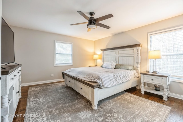 bedroom featuring a ceiling fan, baseboards, and dark wood-style flooring