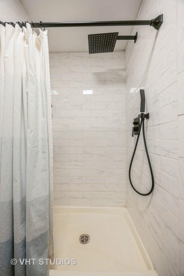 bathroom featuring a shower stall