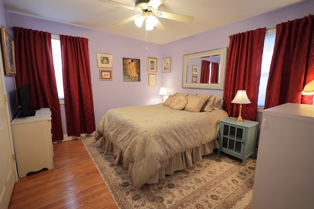 bedroom featuring wood-type flooring and ceiling fan