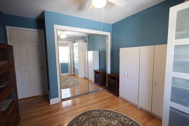 bedroom featuring hardwood / wood-style flooring and ceiling fan