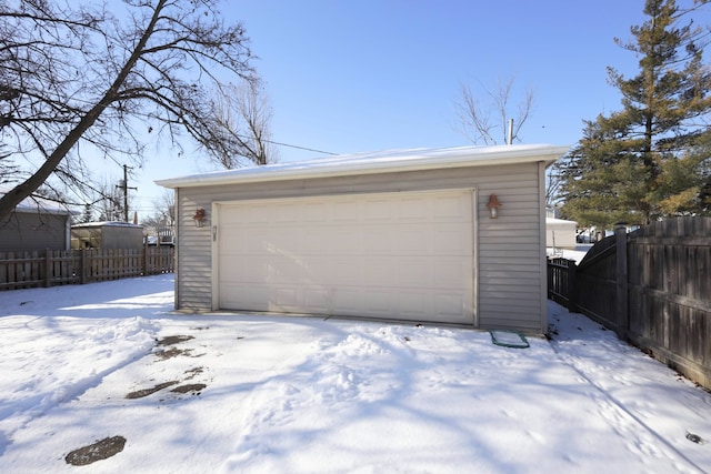 view of snow covered garage