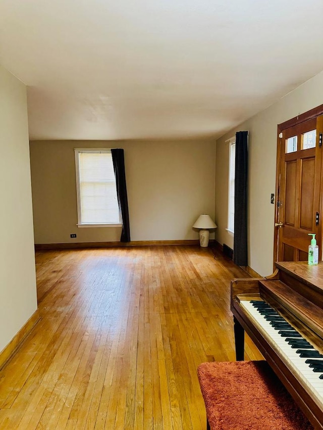 spare room featuring light hardwood / wood-style flooring