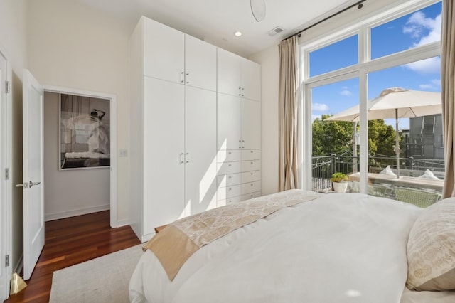 bedroom featuring dark hardwood / wood-style floors