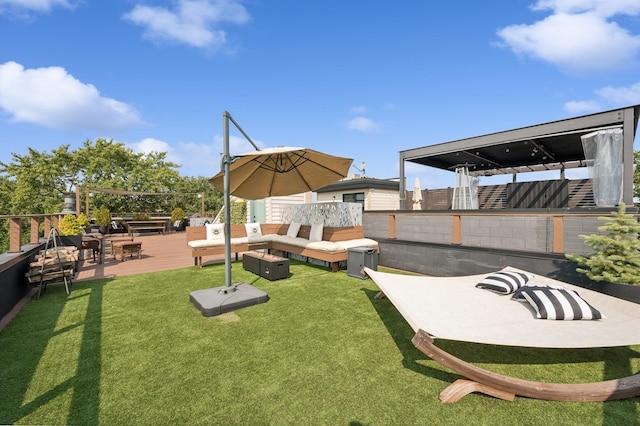 view of yard featuring outdoor lounge area and a deck