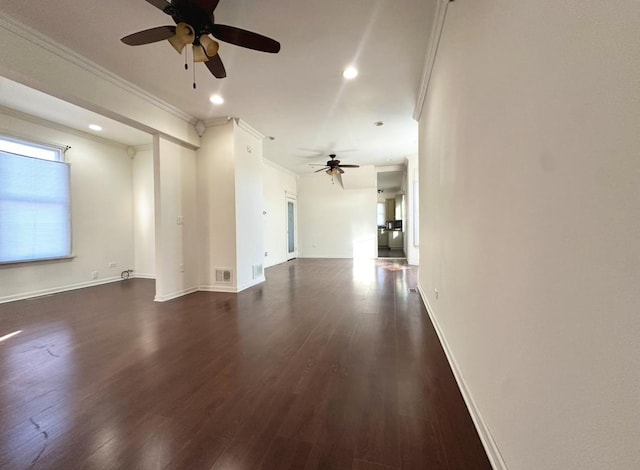 empty room with dark wood-type flooring, ornamental molding, and ceiling fan