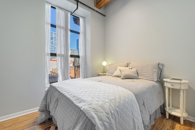 bedroom with hardwood / wood-style flooring