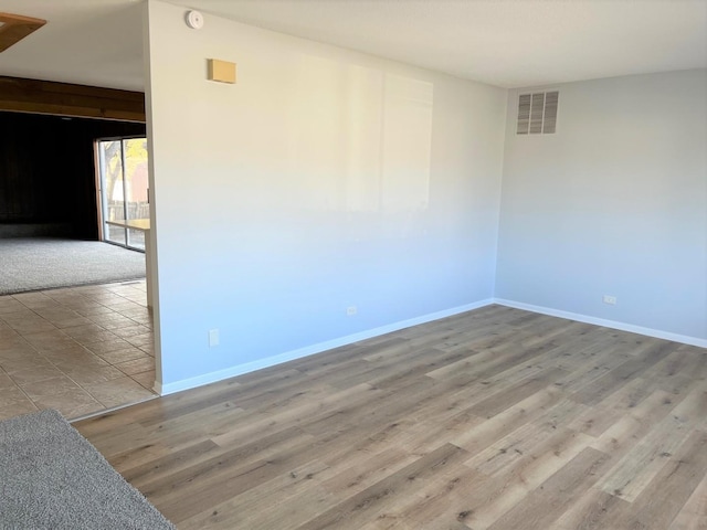 empty room featuring wood-type flooring