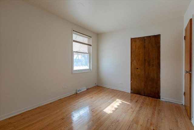 spare room featuring light hardwood / wood-style floors