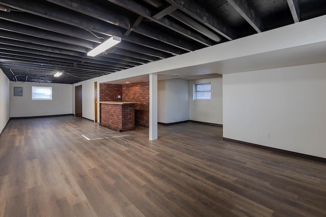 basement with hardwood / wood-style floors