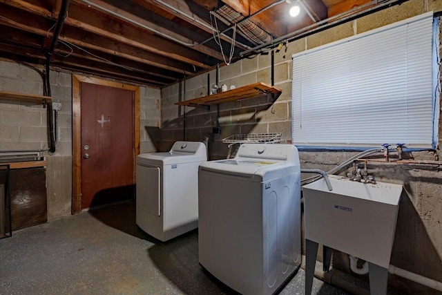 laundry room featuring washer and clothes dryer and sink