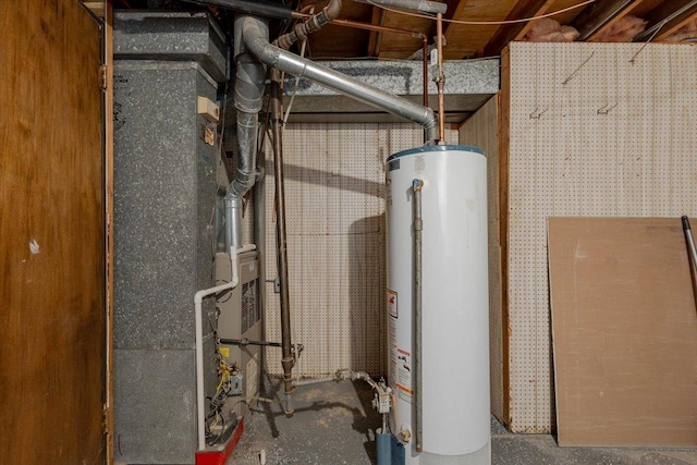 utility room with heating unit and water heater