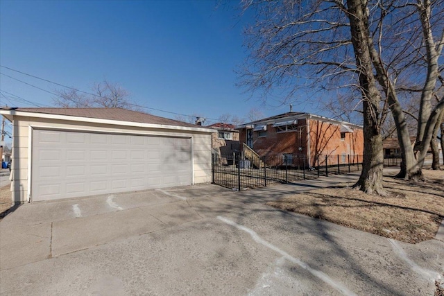 view of front of property featuring an outbuilding and a garage