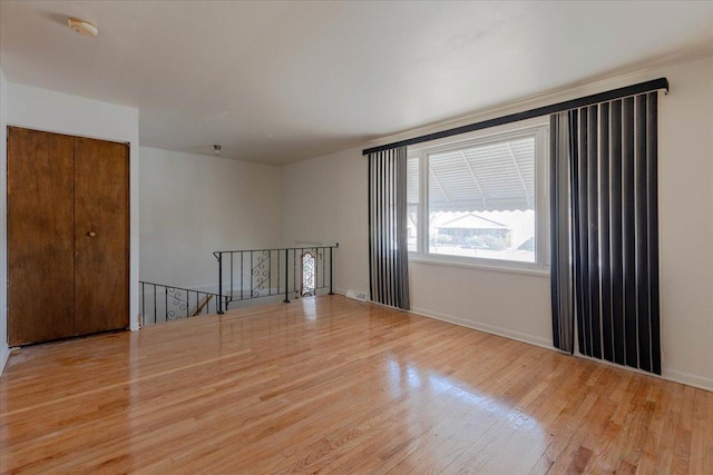 spare room featuring light hardwood / wood-style floors