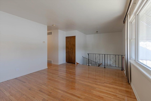 unfurnished room with light hardwood / wood-style floors