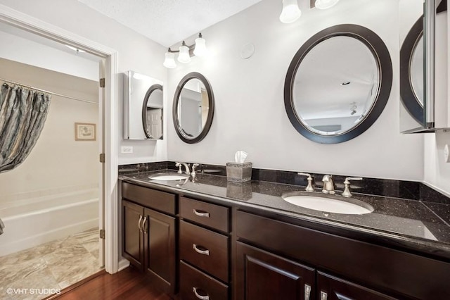 bathroom with shower / bath combination and vanity