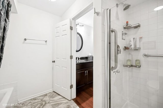 bathroom with vanity and a shower with shower door