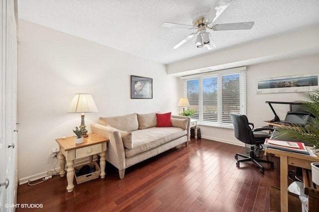 office space featuring ceiling fan, dark hardwood / wood-style flooring, and a textured ceiling