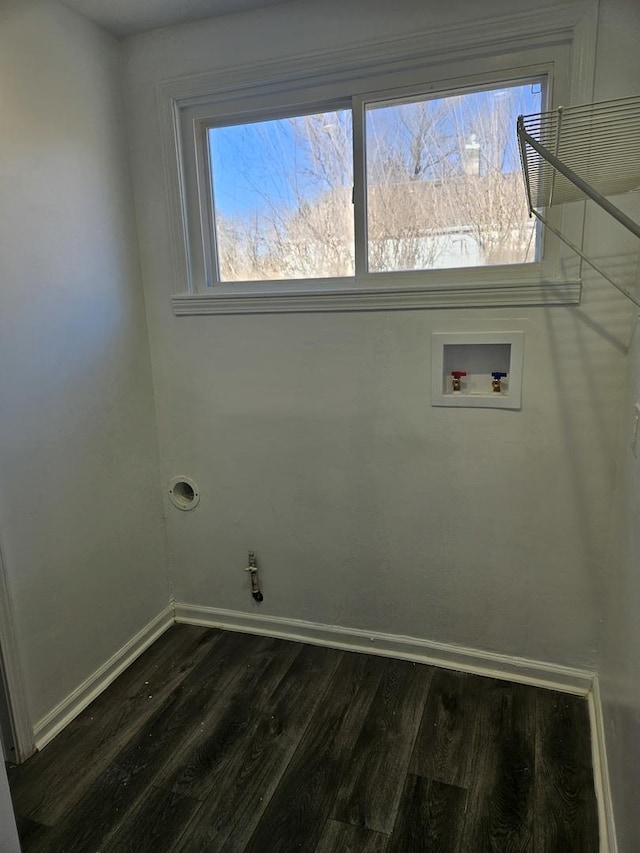 laundry area featuring baseboards, laundry area, washer hookup, and dark wood-style flooring