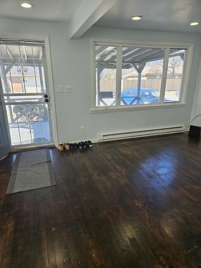 doorway to outside featuring a baseboard heating unit, wood-type flooring, and recessed lighting