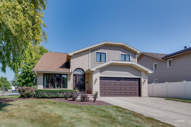 view of front facade featuring a garage and a front yard