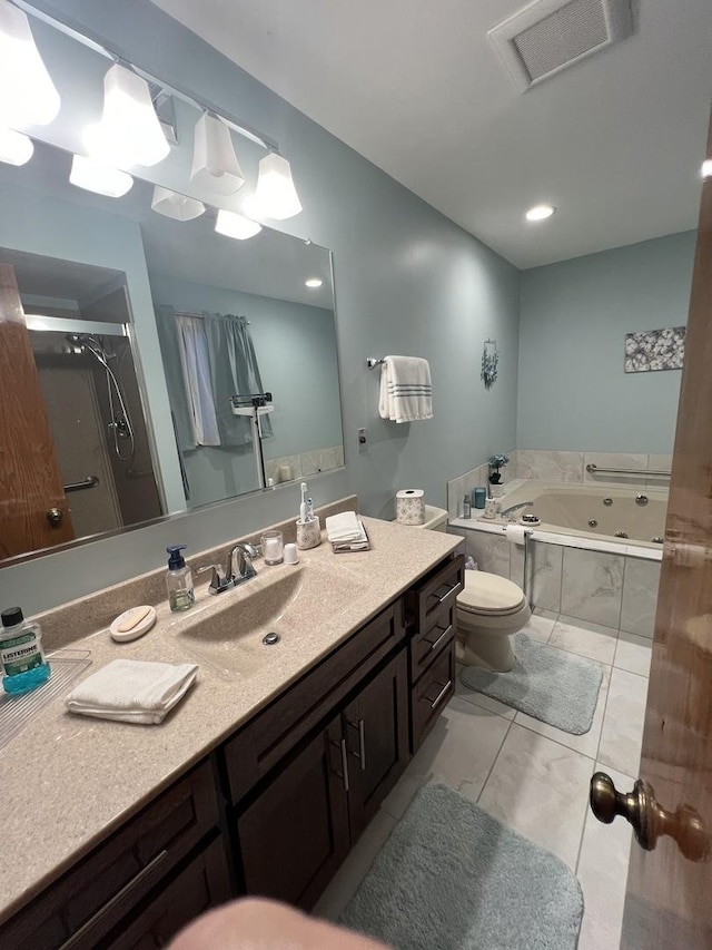 full bathroom with vanity, tile patterned flooring, toilet, and separate shower and tub