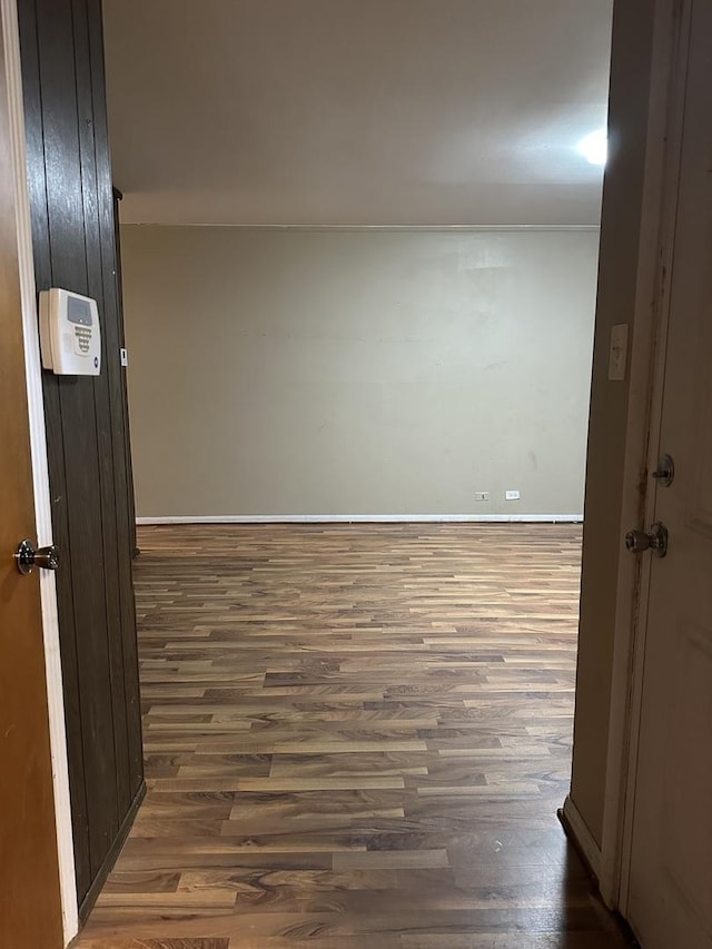 hall with dark hardwood / wood-style flooring