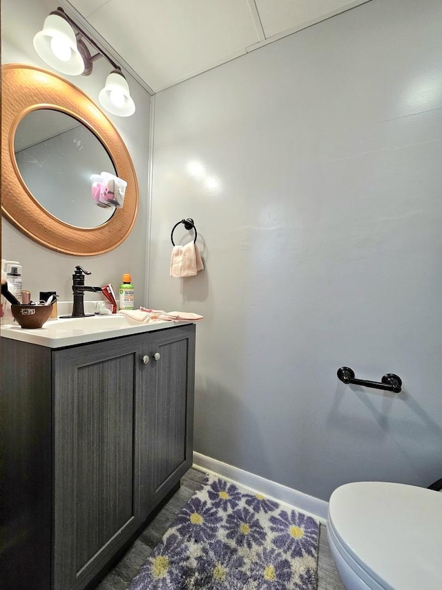 bathroom with vanity and toilet