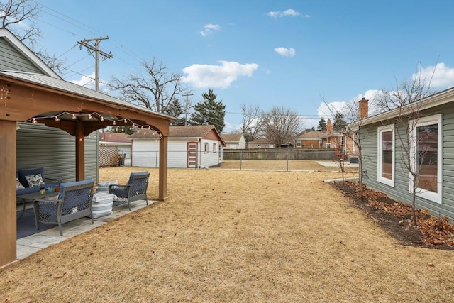 view of yard featuring a shed, an outdoor hangout area, and a patio