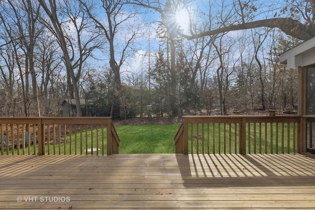 wooden terrace with a yard