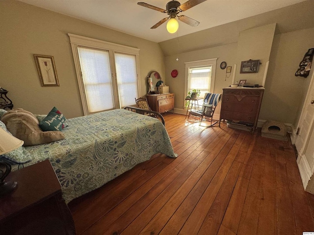 bedroom featuring hardwood / wood-style flooring, ceiling fan, and lofted ceiling