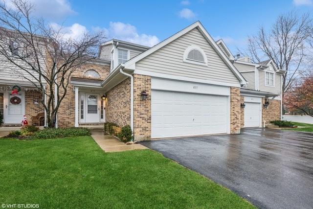 front of property featuring a garage and a front yard