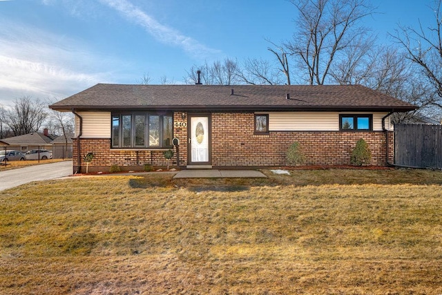 ranch-style home with a front lawn