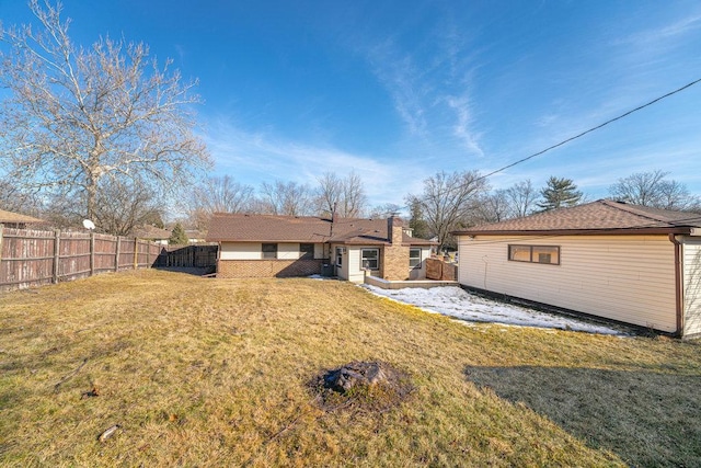 rear view of house with a lawn