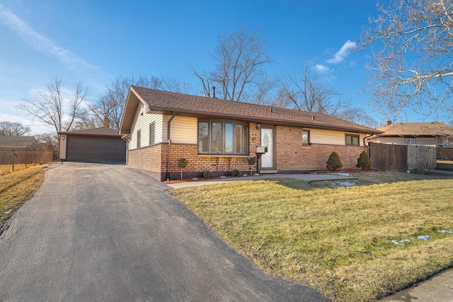 ranch-style house with a front yard and a garage