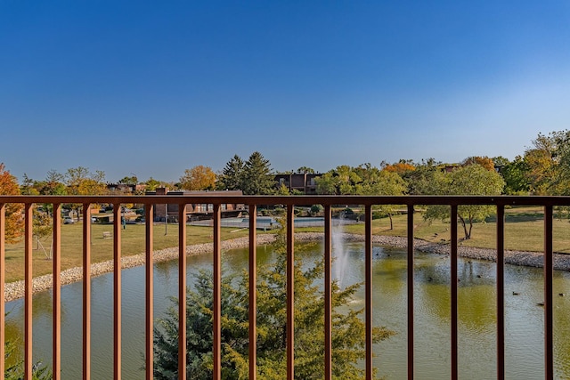 balcony featuring a water view