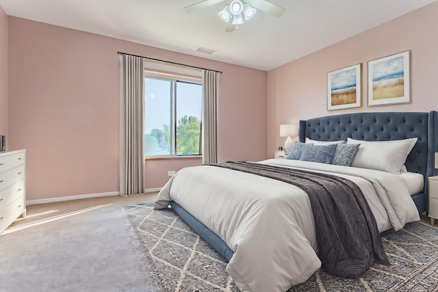 bedroom with ceiling fan and carpet floors