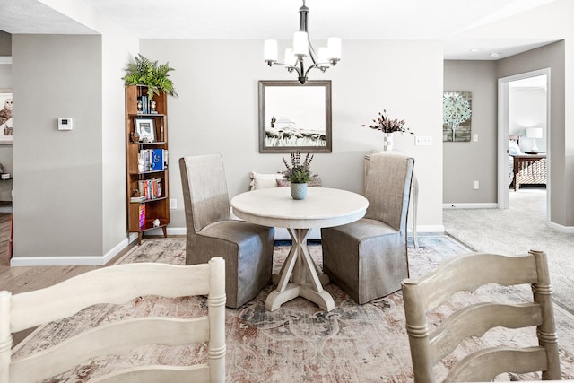 carpeted dining space featuring a notable chandelier