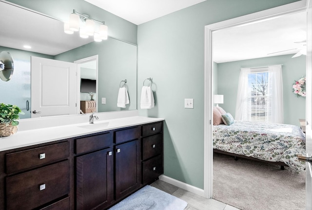 bathroom featuring vanity, tile patterned flooring, and ceiling fan