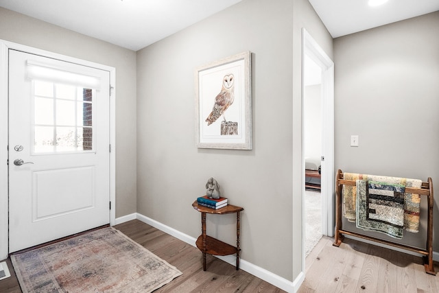 doorway to outside with light hardwood / wood-style flooring