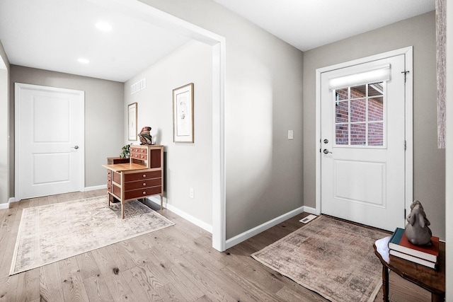 foyer with light wood-type flooring