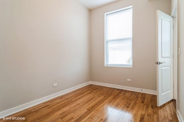 spare room featuring light hardwood / wood-style floors