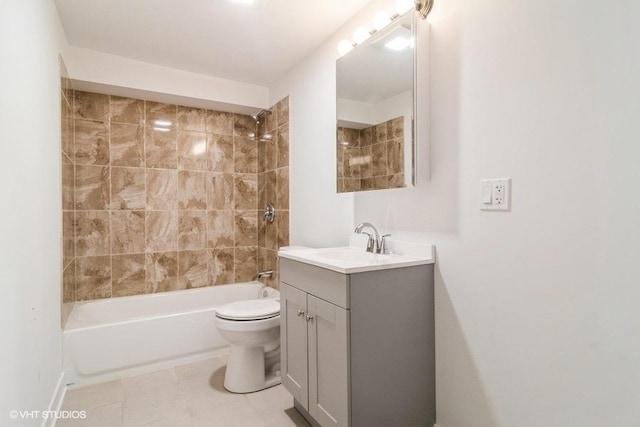 full bathroom with tiled shower / bath combo, vanity, tile patterned floors, and toilet