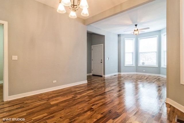 unfurnished room with dark wood-type flooring, ceiling fan with notable chandelier, and beam ceiling