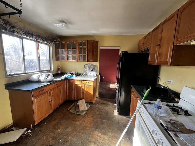 kitchen featuring black refrigerator and gas range gas stove